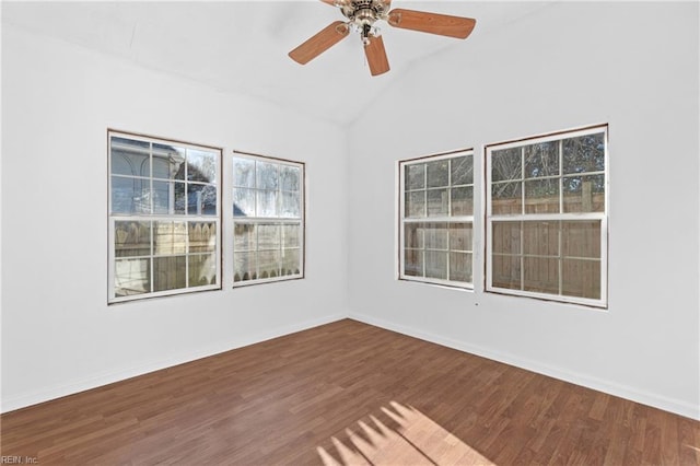 spare room featuring hardwood / wood-style flooring, ceiling fan, and lofted ceiling