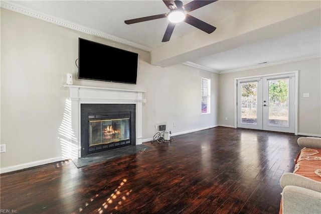 unfurnished living room with hardwood / wood-style flooring, ceiling fan, ornamental molding, and french doors