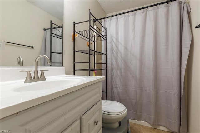 bathroom featuring tile patterned flooring, a textured ceiling, toilet, vanity, and a shower with shower curtain