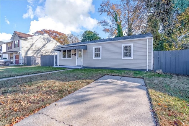 view of front of property with a patio and a front lawn