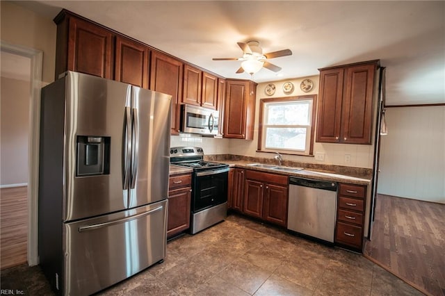 kitchen with ceiling fan, sink, and appliances with stainless steel finishes