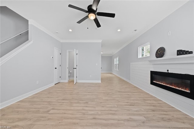 unfurnished living room featuring ceiling fan, crown molding, and light hardwood / wood-style flooring