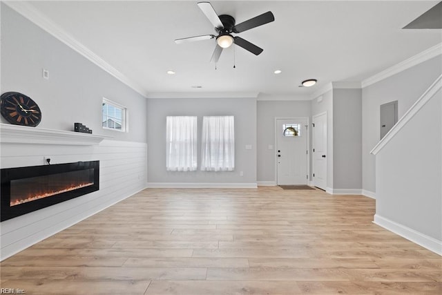 unfurnished living room featuring crown molding, ceiling fan, and light wood-type flooring