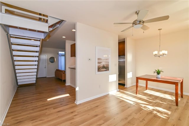 interior space featuring hardwood / wood-style floors and a notable chandelier