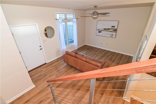 living room with ceiling fan and hardwood / wood-style floors