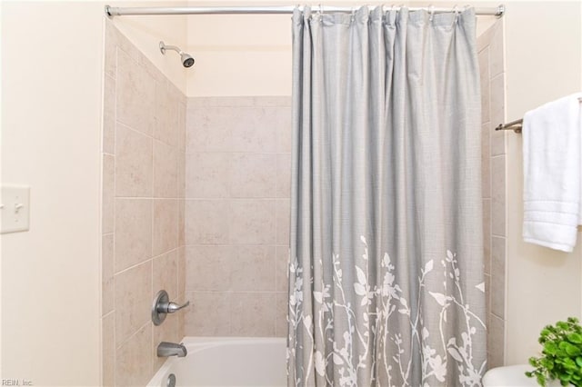 bathroom featuring shower / bathtub combination with curtain