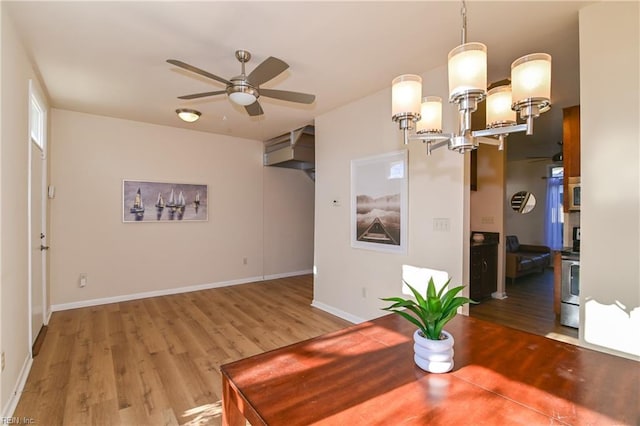 dining room featuring ceiling fan and hardwood / wood-style floors