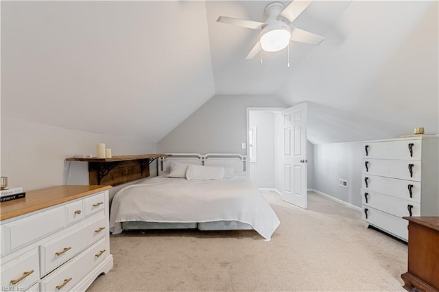 carpeted bedroom featuring ceiling fan and vaulted ceiling