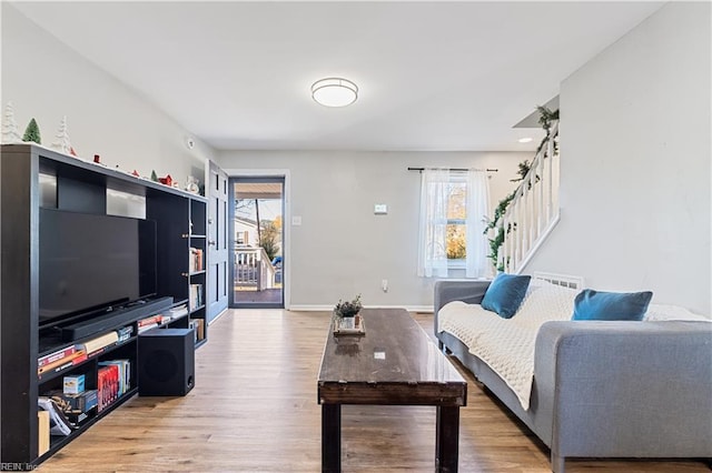 living room featuring hardwood / wood-style flooring and a wealth of natural light