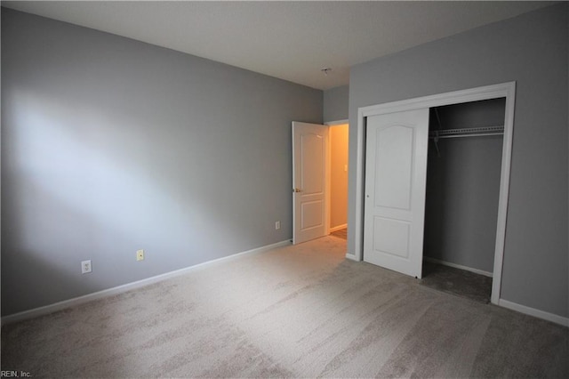 unfurnished bedroom featuring a closet and carpet floors