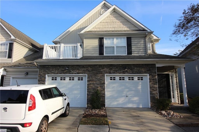 view of front of home with a balcony and a garage