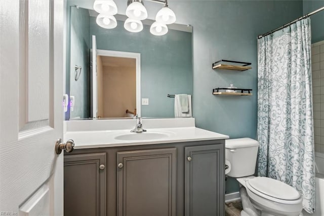 full bathroom with vanity, shower / bath combo, and toilet