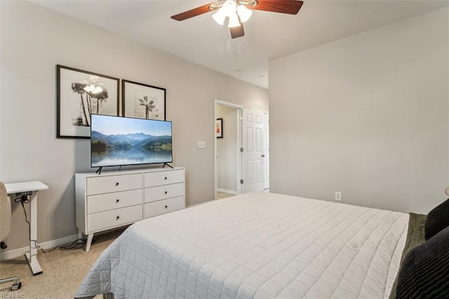 bedroom featuring light colored carpet and ceiling fan