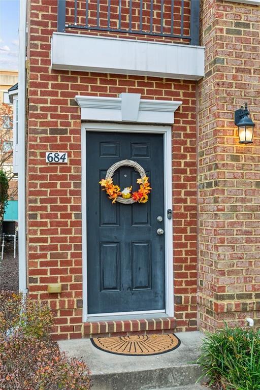 doorway to property featuring a balcony