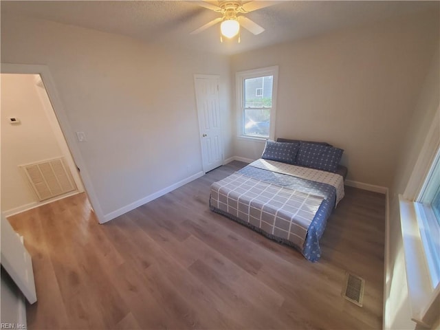 bedroom featuring ceiling fan and wood-type flooring