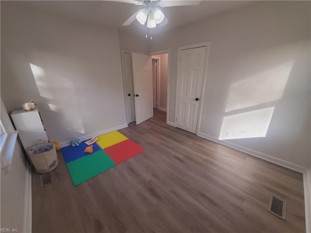 recreation room with hardwood / wood-style floors and ceiling fan