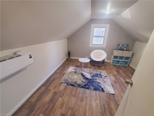 interior space featuring dark wood-type flooring and vaulted ceiling