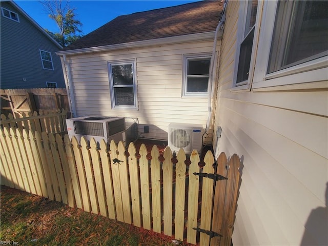 view of side of property with ac unit