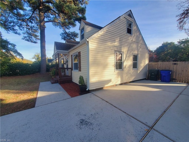 view of side of property featuring a patio area