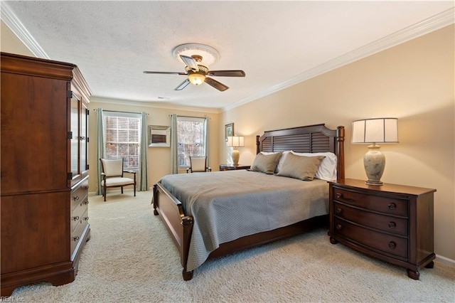 carpeted bedroom with a textured ceiling, ceiling fan, and crown molding