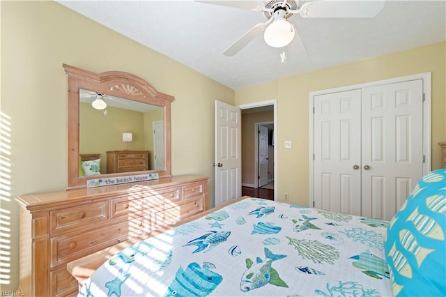 bedroom featuring ceiling fan and a closet