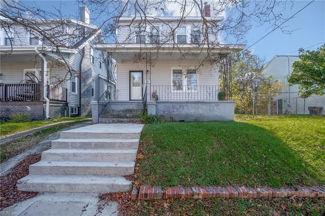 bungalow-style home with covered porch and a front yard