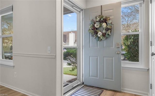 entryway with light hardwood / wood-style floors