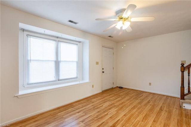 unfurnished living room featuring light hardwood / wood-style flooring and ceiling fan