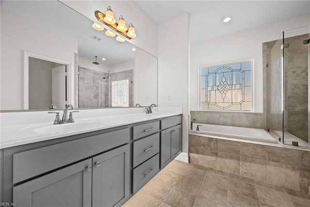 bathroom featuring vanity, tile patterned floors, and independent shower and bath