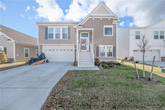 view of front of property featuring a garage and a front yard