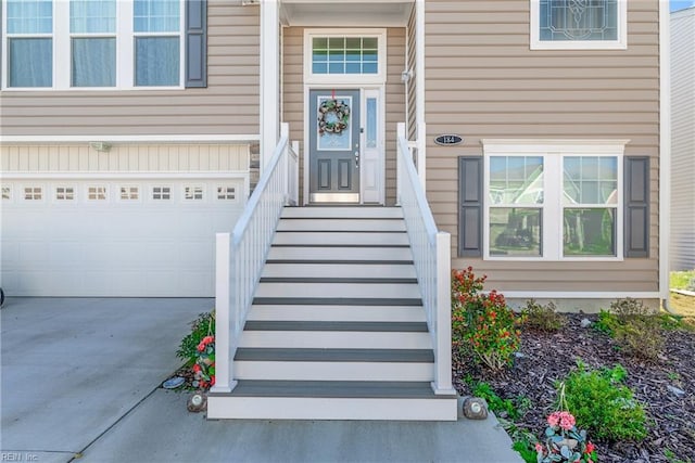 doorway to property featuring a garage