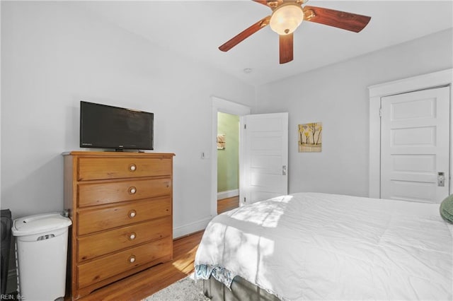 bedroom with ceiling fan and light hardwood / wood-style floors