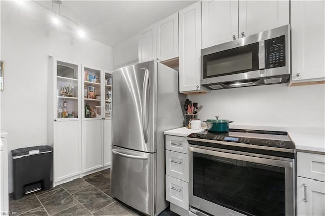 kitchen featuring white cabinets and stainless steel appliances