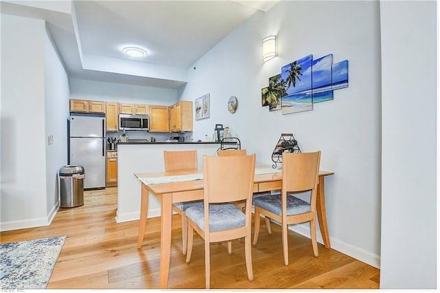 dining space featuring light hardwood / wood-style floors