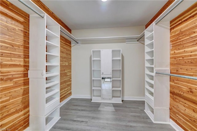 spacious closet featuring hardwood / wood-style floors