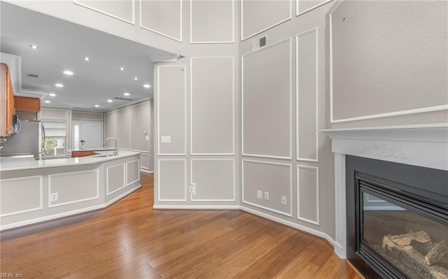 unfurnished living room featuring light hardwood / wood-style floors