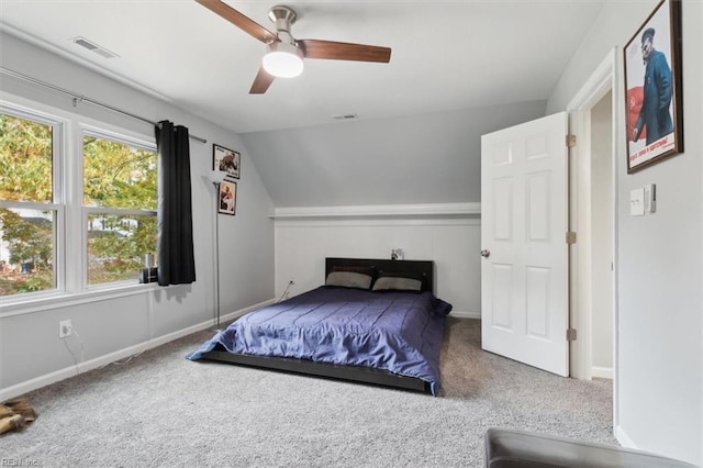 bedroom with carpet flooring, vaulted ceiling, and ceiling fan