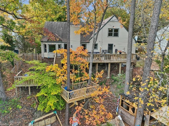 rear view of house with a wooden deck