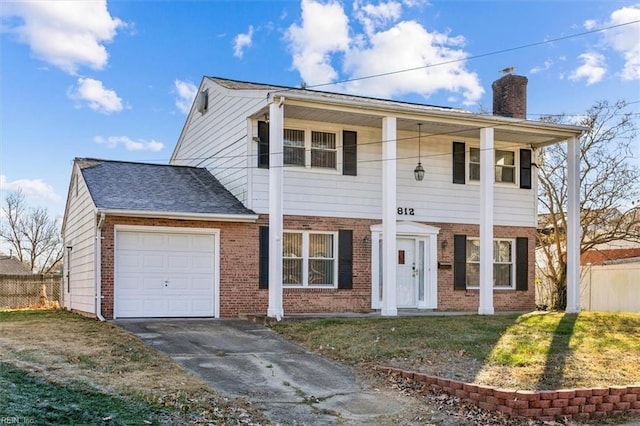 view of front facade with a porch, a garage, and a front lawn