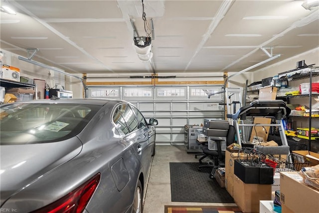 garage featuring a garage door opener