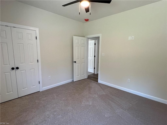 unfurnished bedroom with carpet flooring, a closet, and ceiling fan