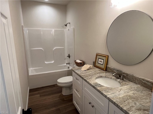 full bathroom with wood-type flooring, vanity, toilet, and shower / washtub combination