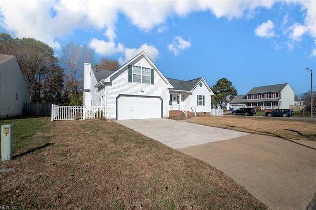 view of front property featuring a garage and a front yard