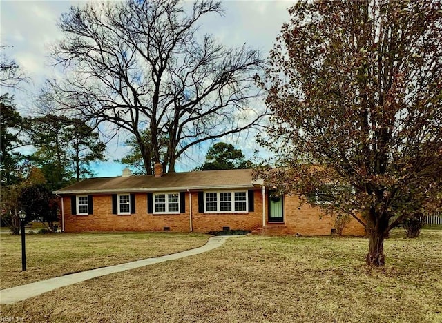 ranch-style house with a front lawn