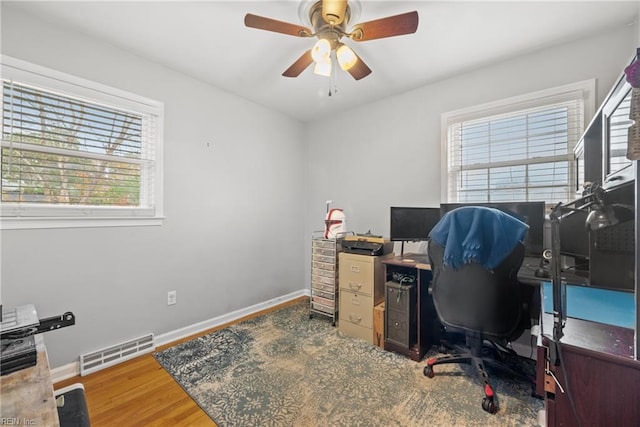 office space featuring hardwood / wood-style flooring and ceiling fan