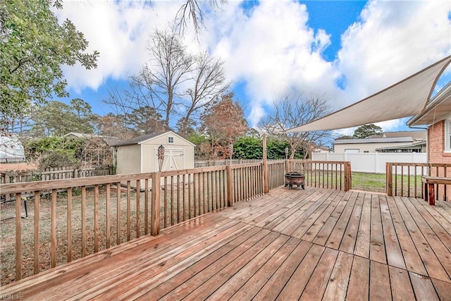 wooden deck featuring a storage shed