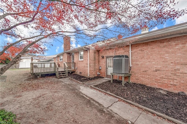 view of side of home with a deck