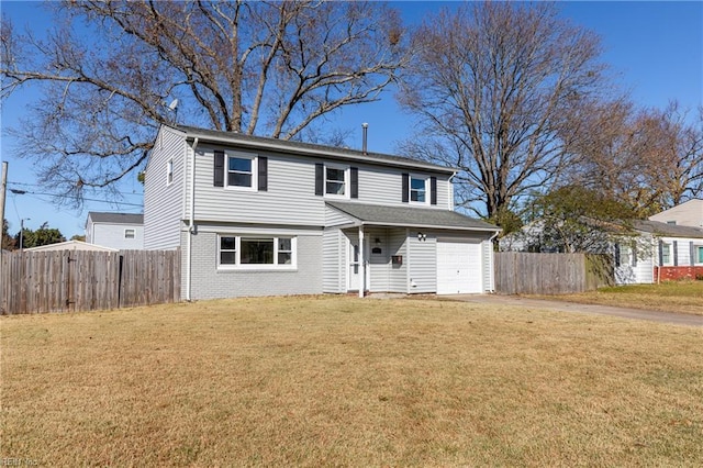 view of front property featuring a front yard and a garage