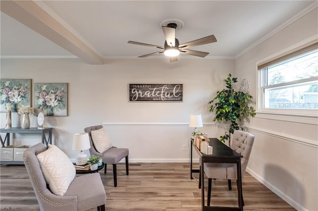 sitting room featuring ceiling fan, hardwood / wood-style floors, and ornamental molding