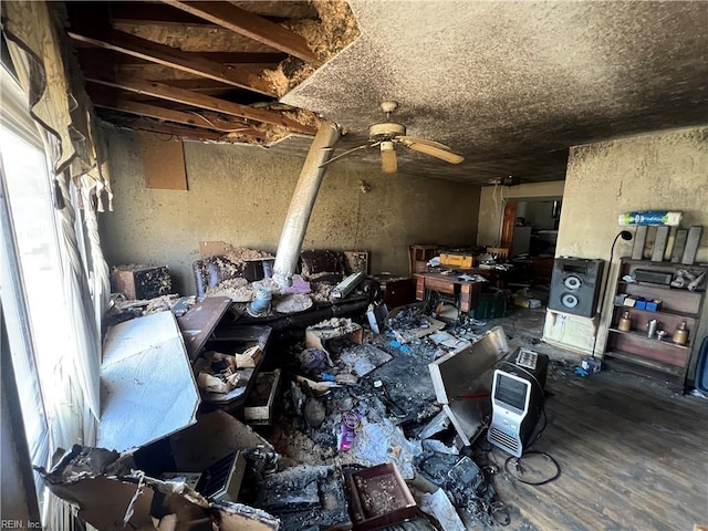 miscellaneous room with wood-type flooring and ceiling fan